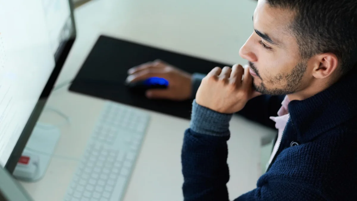 Man researching on monitor
